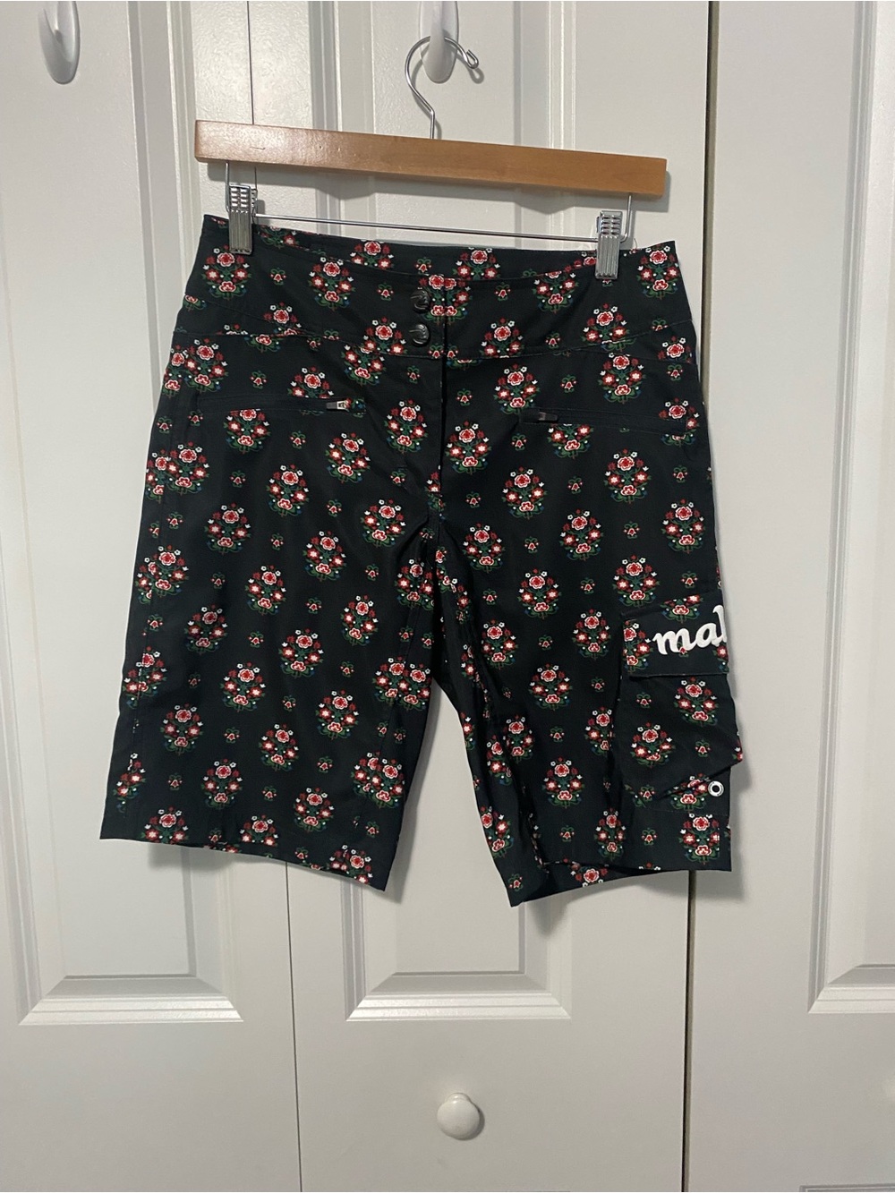 Maloja Black Floral Cycling Shorts with Red & Green Accents